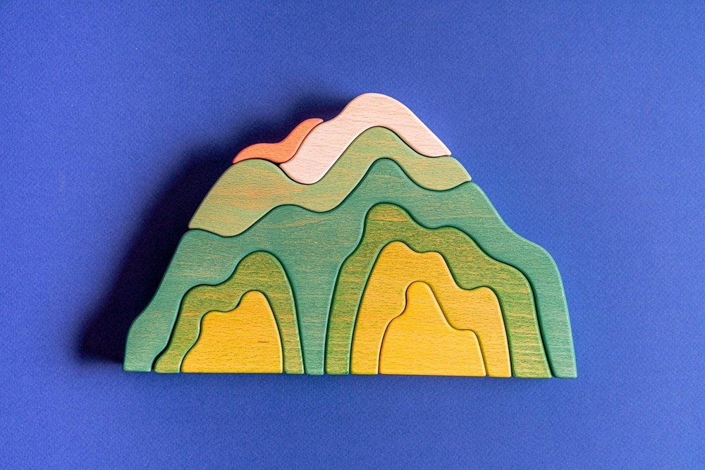 mountain puzzle shapes on a blue background
