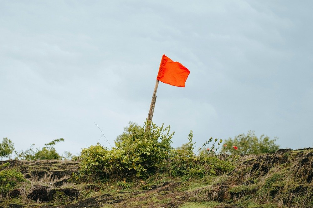 Red flag stuck into the ground